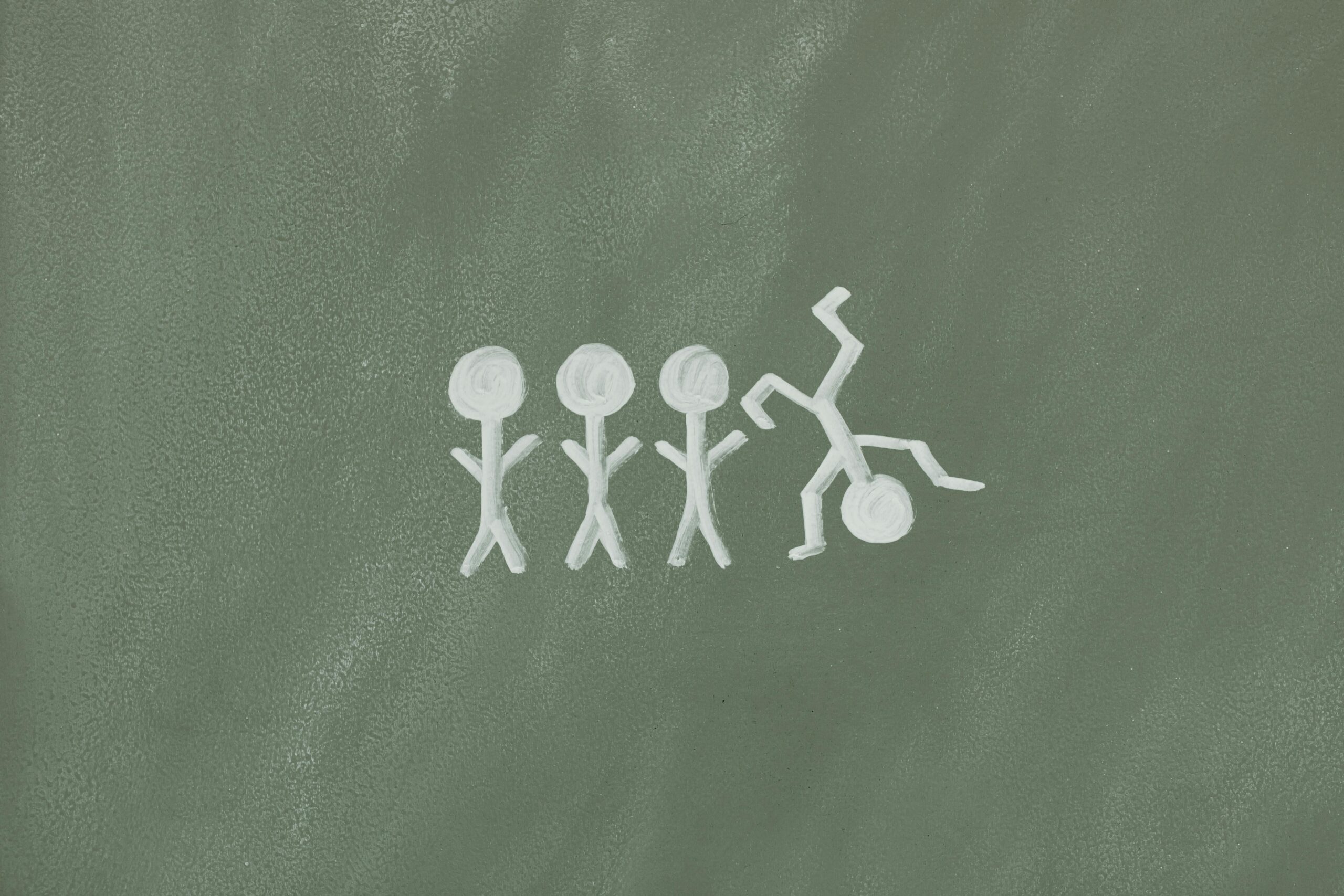 Illustration of stick figures on a chalkboard, symbolizing diversity and inclusion.